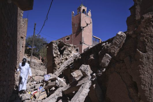 A man walks amid the rubble in front of a damaged mosque in Moulay Brahim in the province of Al Haouz, Morocco, Sunday Sept. 10, 2023. An aftershock rattled Moroccans on Sunday as they prayed for victims of the nation’s strongest earthquake in more than a century and toiled to rescue survivors while soldiers and workers brought water and supplies to desperate mountain villages in ruins. (Fernando Sanchez/Europa Press via AP)